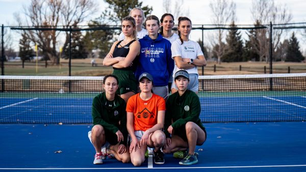 The CSU women's tennis team stands together on a tennis court, looking formidable