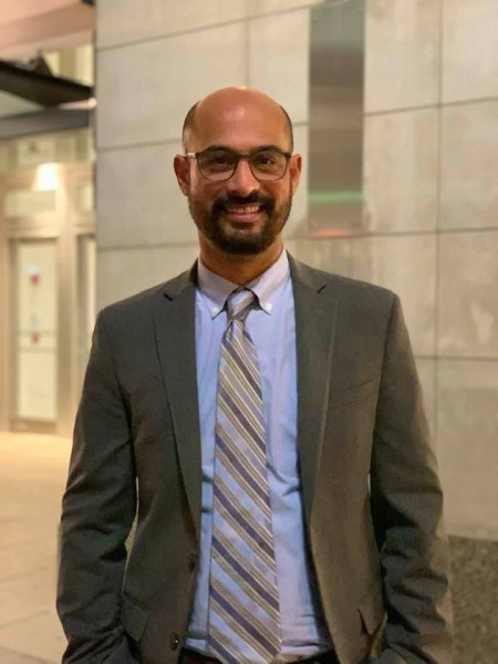 Head shot of Assistant Professor in the Department of Communication Studies, Abe Khan.