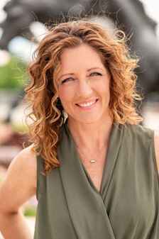 Headshot of Susie Wargin in a green top 