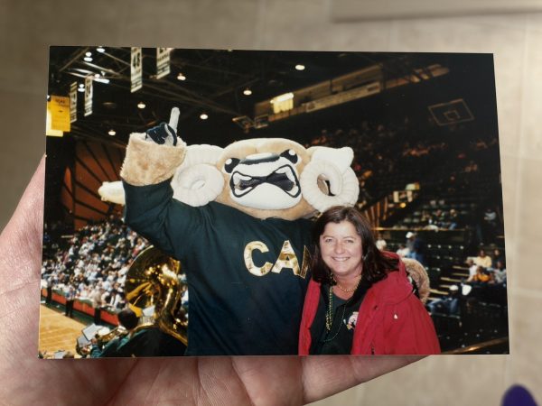 Brady O’Neill dressed as CAM the Ram poses with his mother inside Moby Arena during his time as a CSU student.